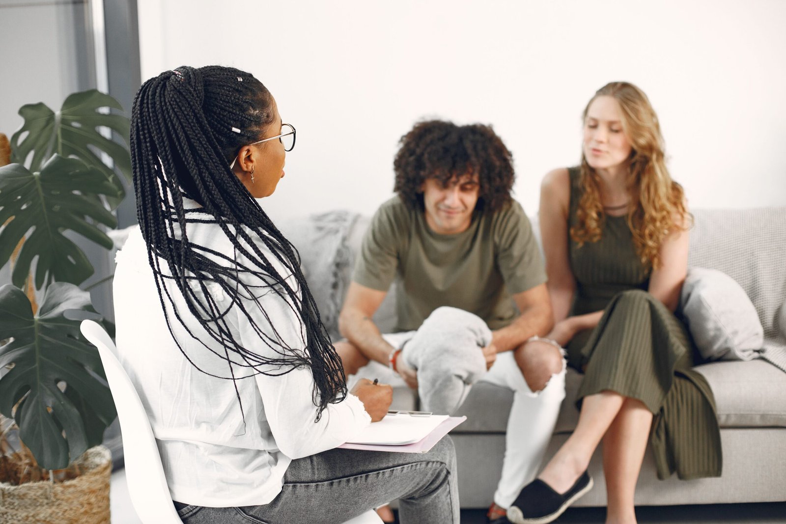 A professional supporting clients during a consultation
